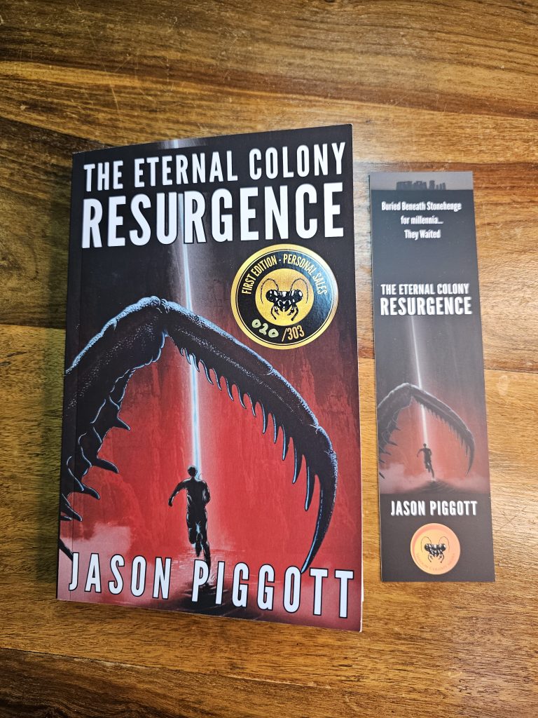 A copy of Resurgence with a bookmark on an oak table